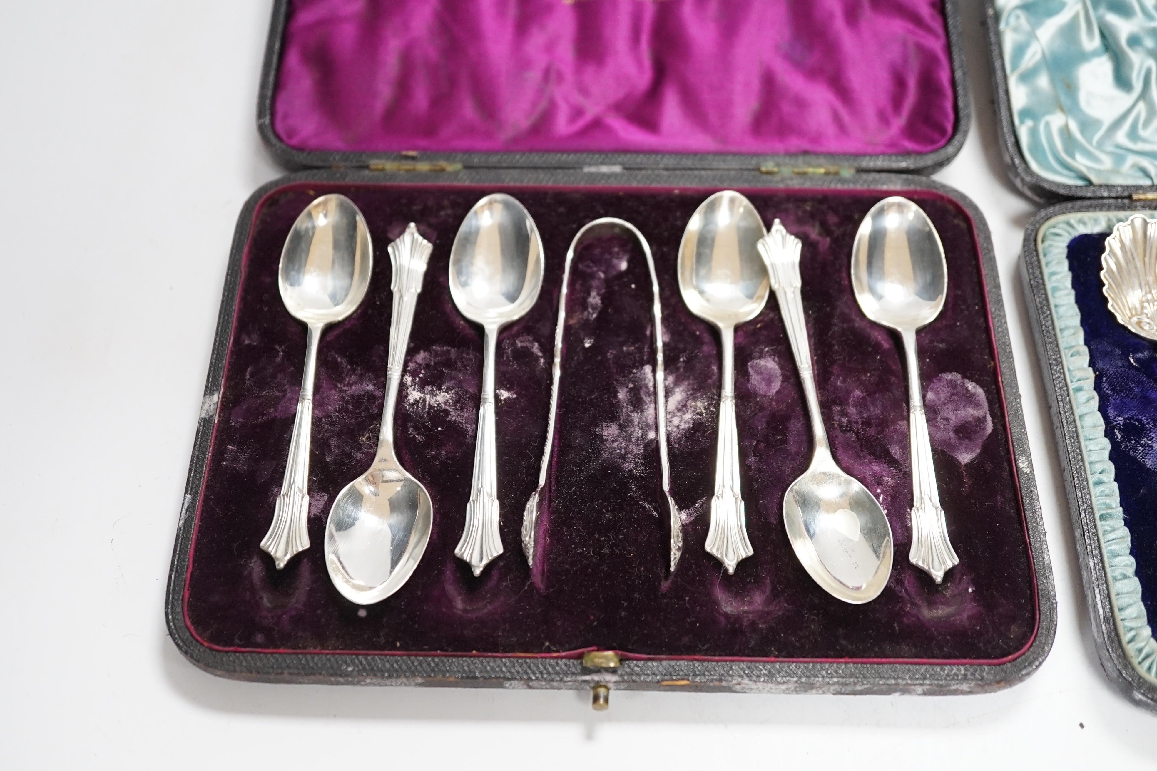 A cased set of six late Victorian silver teaspoons, Mappin & Webb, Sheffield, 1893 and one other later similar cased set with sugar tongs.